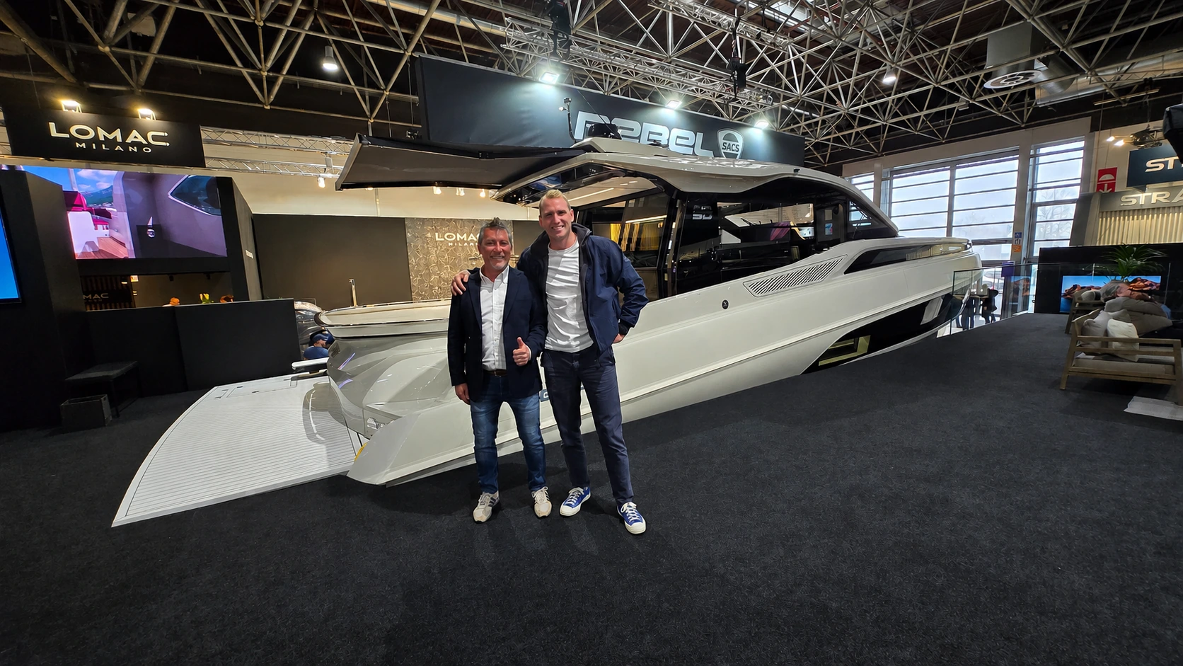 Foiling yacht project shown at a boat show.