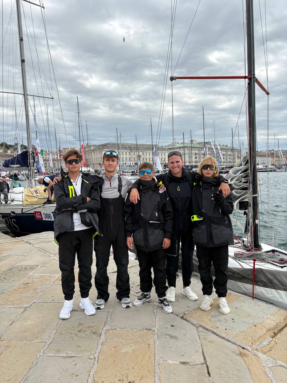 Regatta team gathered at a marina.