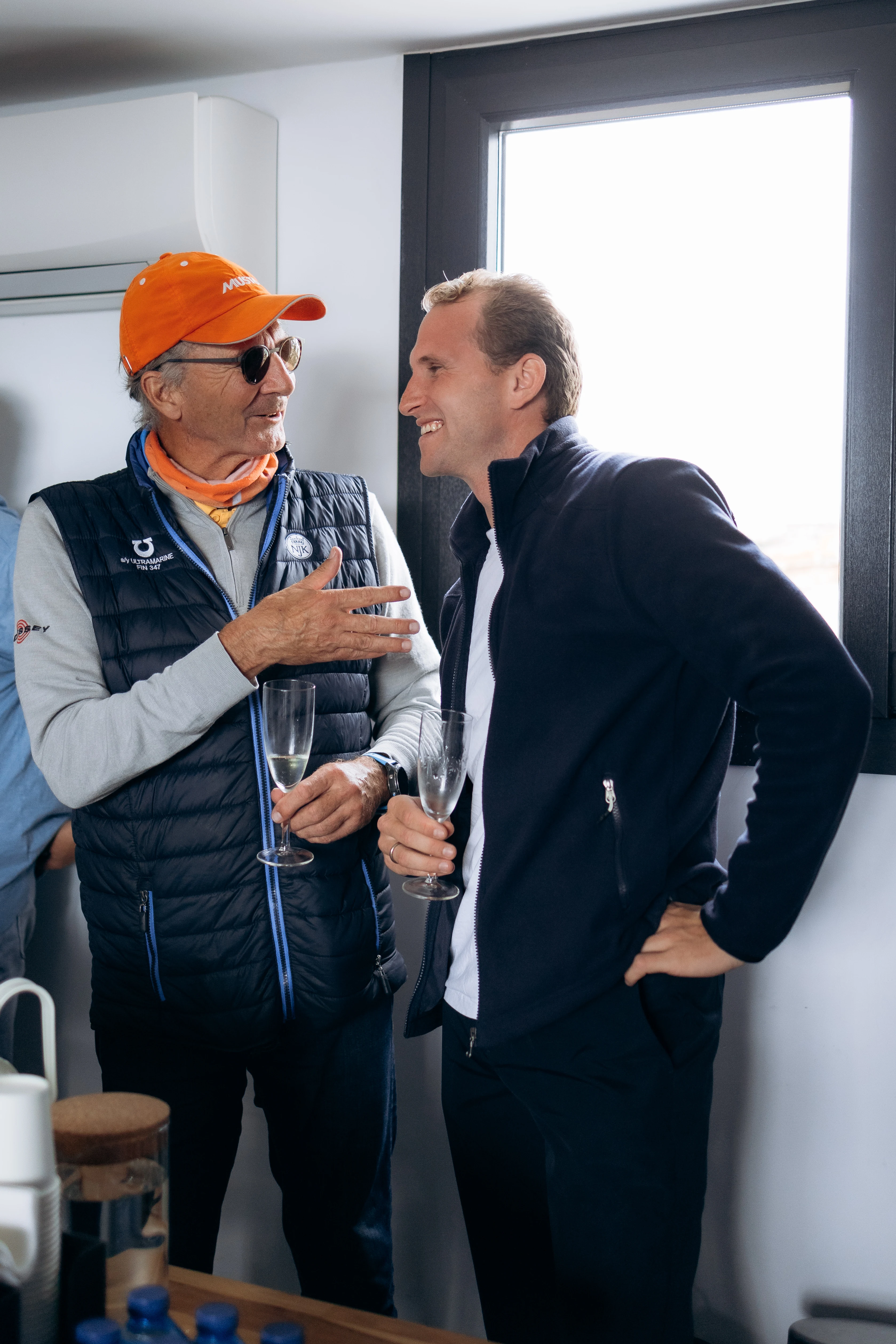 Client conversation in a calm yachting advisory setting.