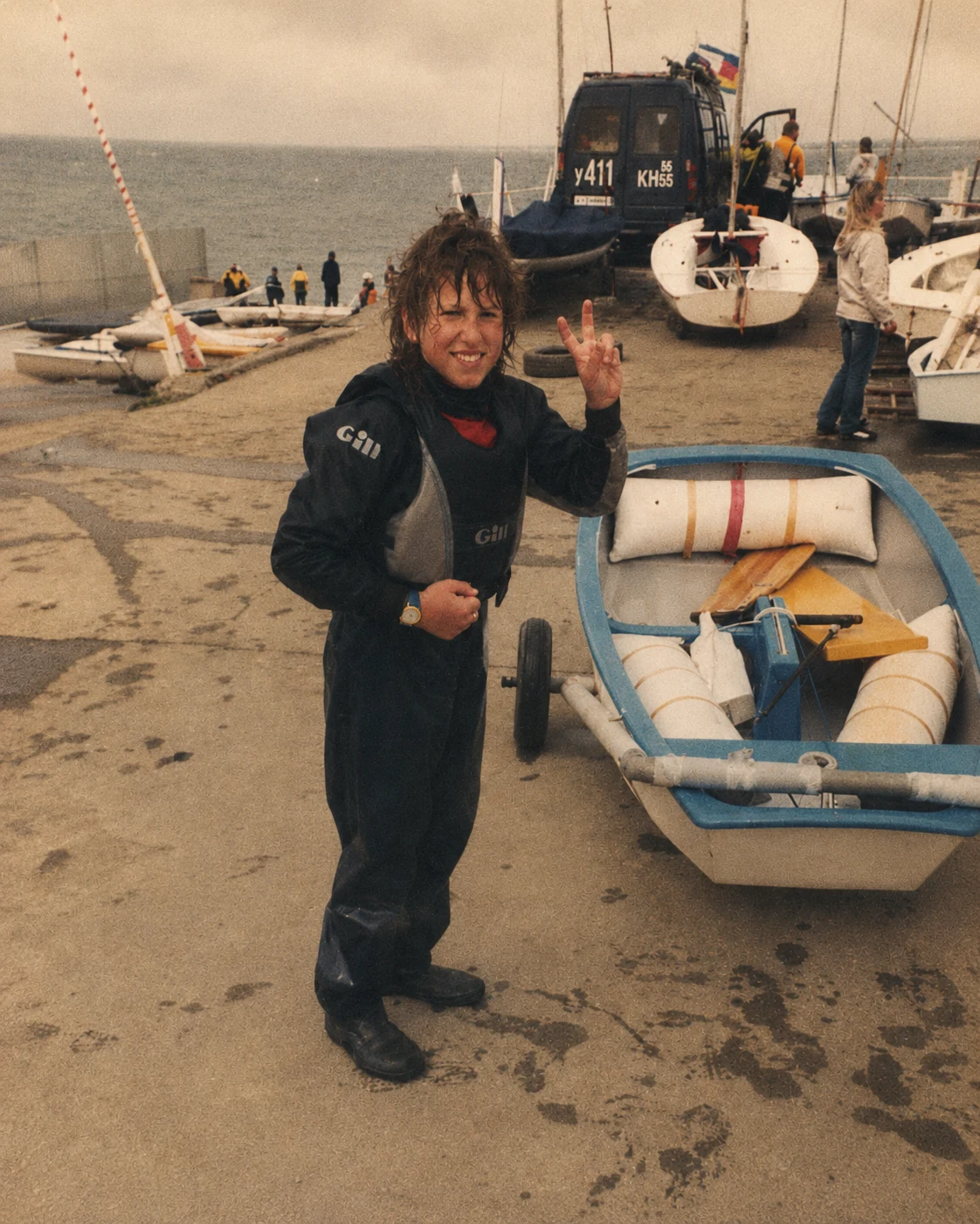 Young sailor Denis Kotlyarov at a marina.